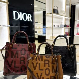 Leather handbag with long shoulder strap